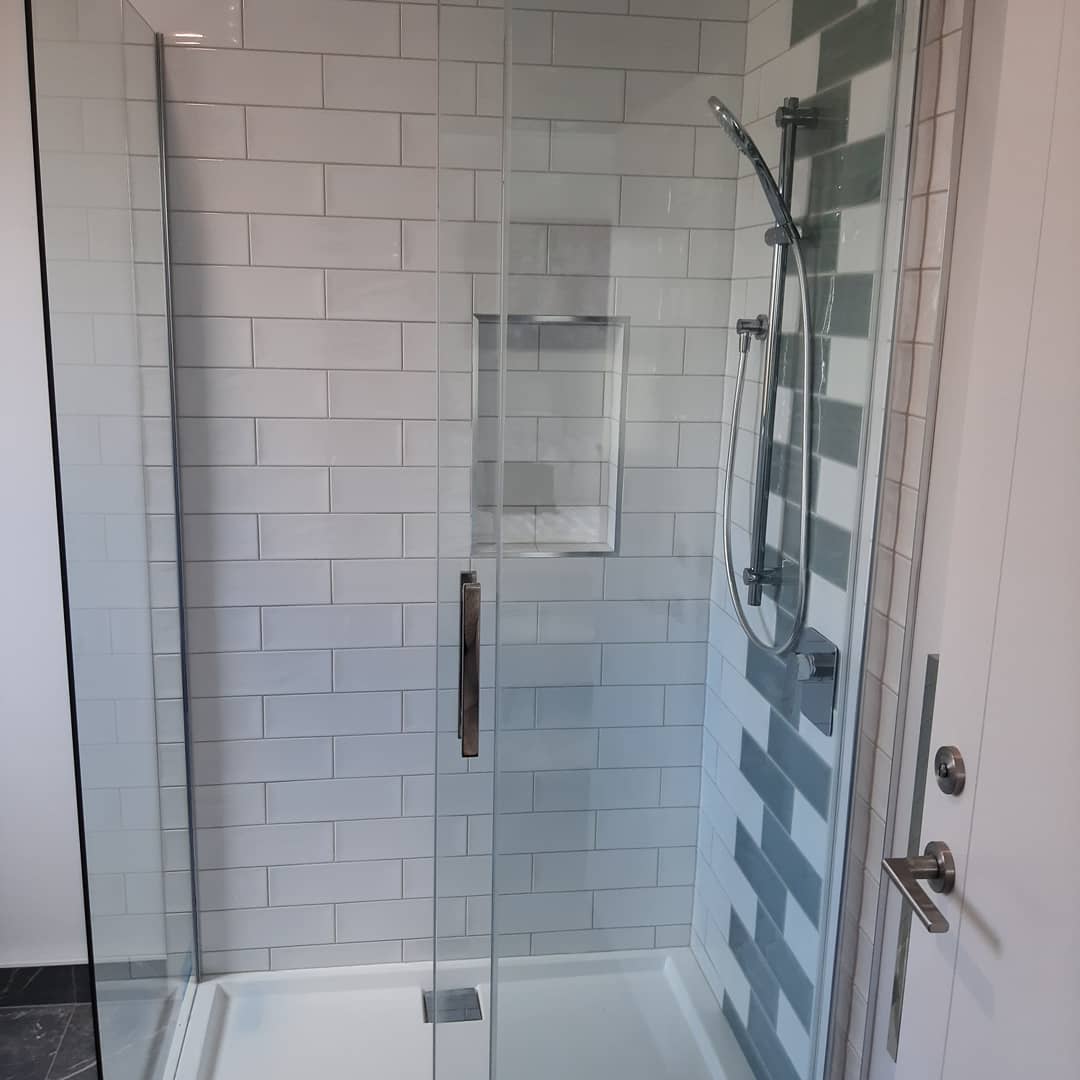 Tiled shower with frameless glass door