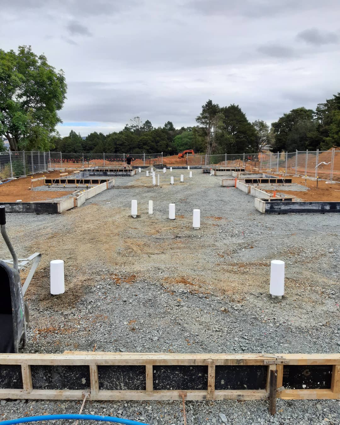 New-build plumbing rough-in on a fresh foundation